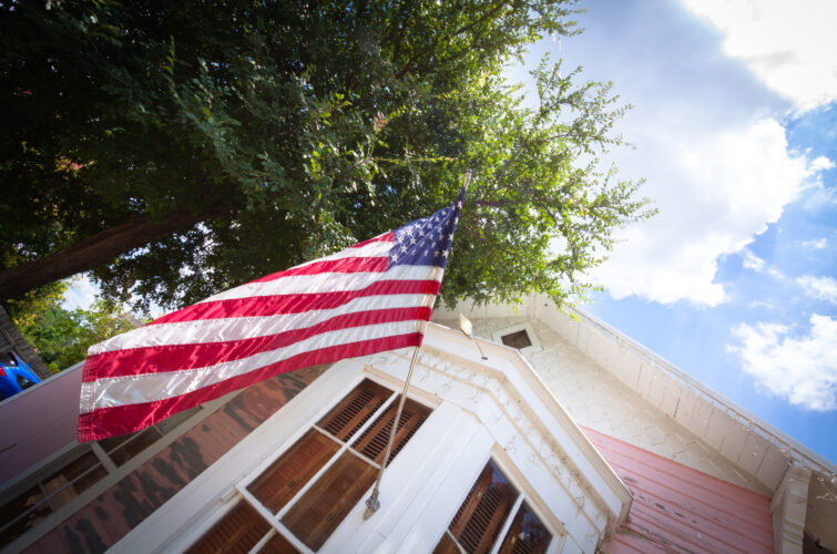American flag hosted in a house