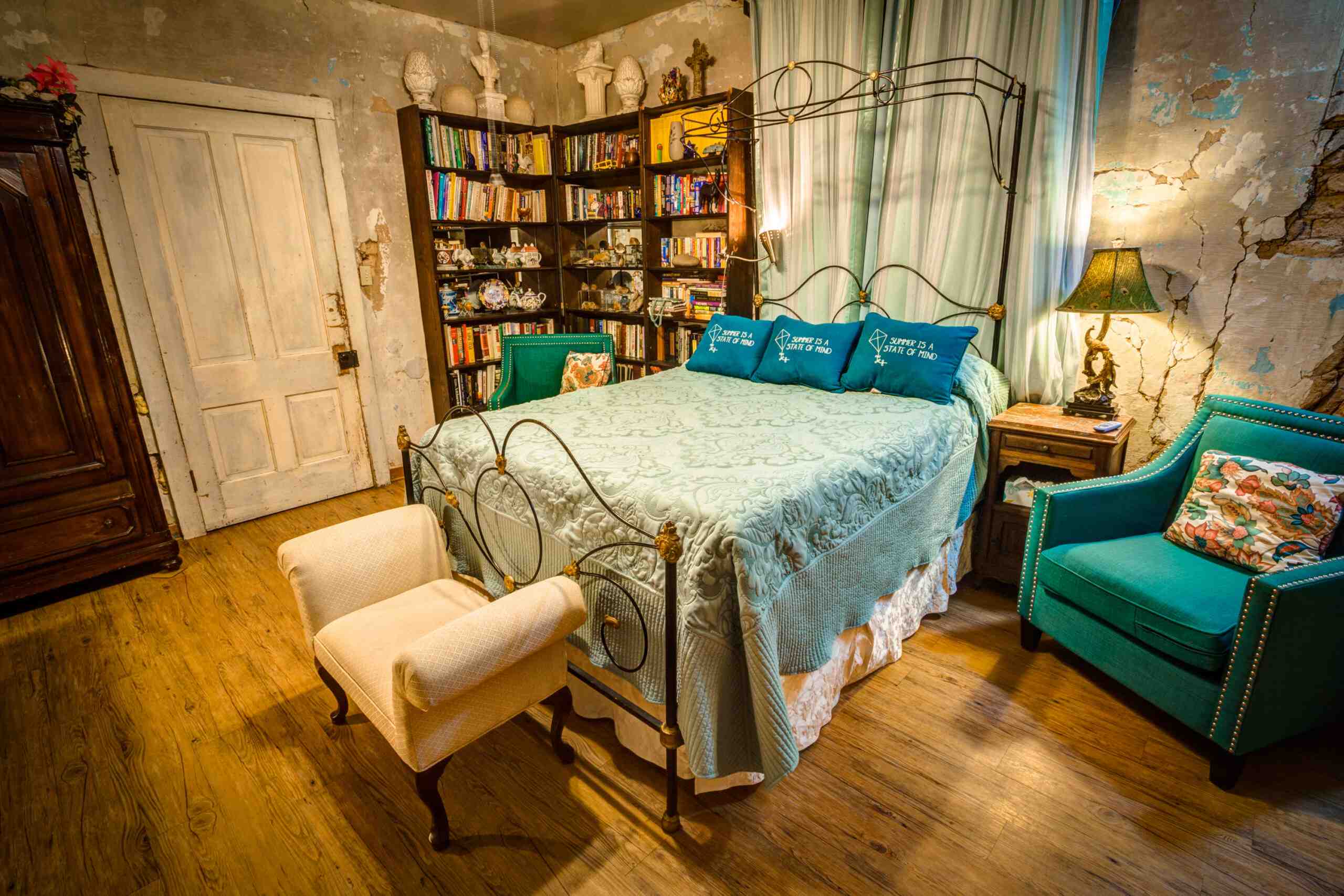 A bed with light blue sheets
